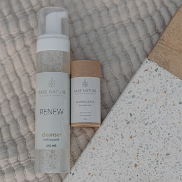 Two 'Bare Nature' skincare products on a textured surface
