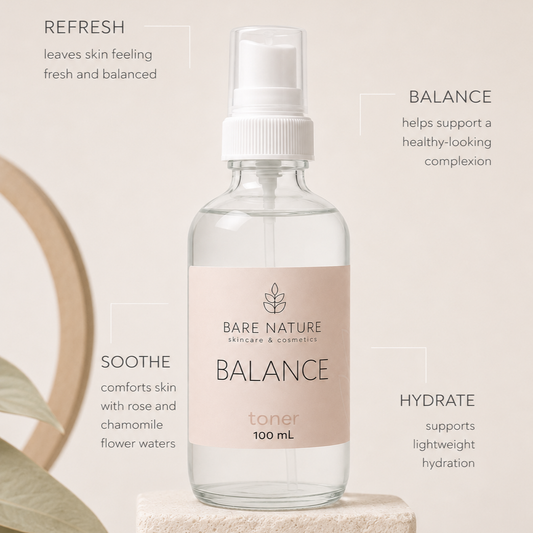 A 100 mL spray bottle of Bare Nature Botanicals Balance Toner, displayed on a textured stone pedestal with decorative leaves and text callouts describing its skin benefits.