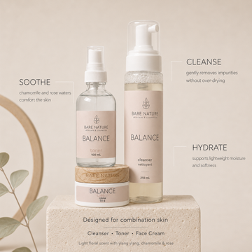 Three Bare Nature Balance skincare products arranged on a stone pedestal against a warm beige background: a small jar, a spray bottle, and a pump bottle, with descriptive text overlays for soothe, cleanse, and hydrate. Bare Nature Skincare Balance Skincare Set for Combination Skin with Chamomile and Rose