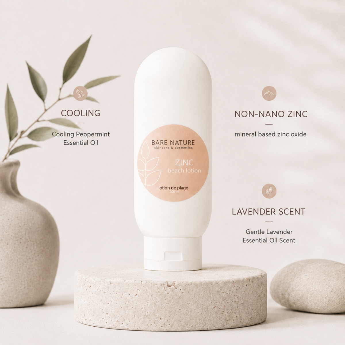 A white bottle of Bare Nature Zinc Lotion de Plage (cooling lavender essential oil lotion) displayed on a textured stone pedestal. The background is a soft beige with a decorative vase on the left and a stone on the right, with text overlays detailing the product's cooling, non-nano zinc, and lavender scent properties.