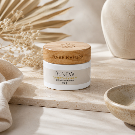 Jar of Bare Nature Renew corrective cream on a wooden surface with natural elements.